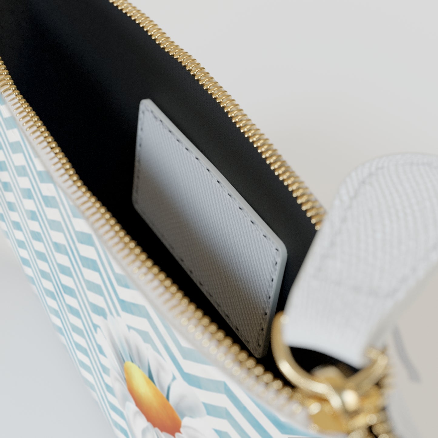 Perfect for quick trip to the store, travel, or a night out, the mini clutch bag holds your bare  essentials so you're not bogged down by a big bag.