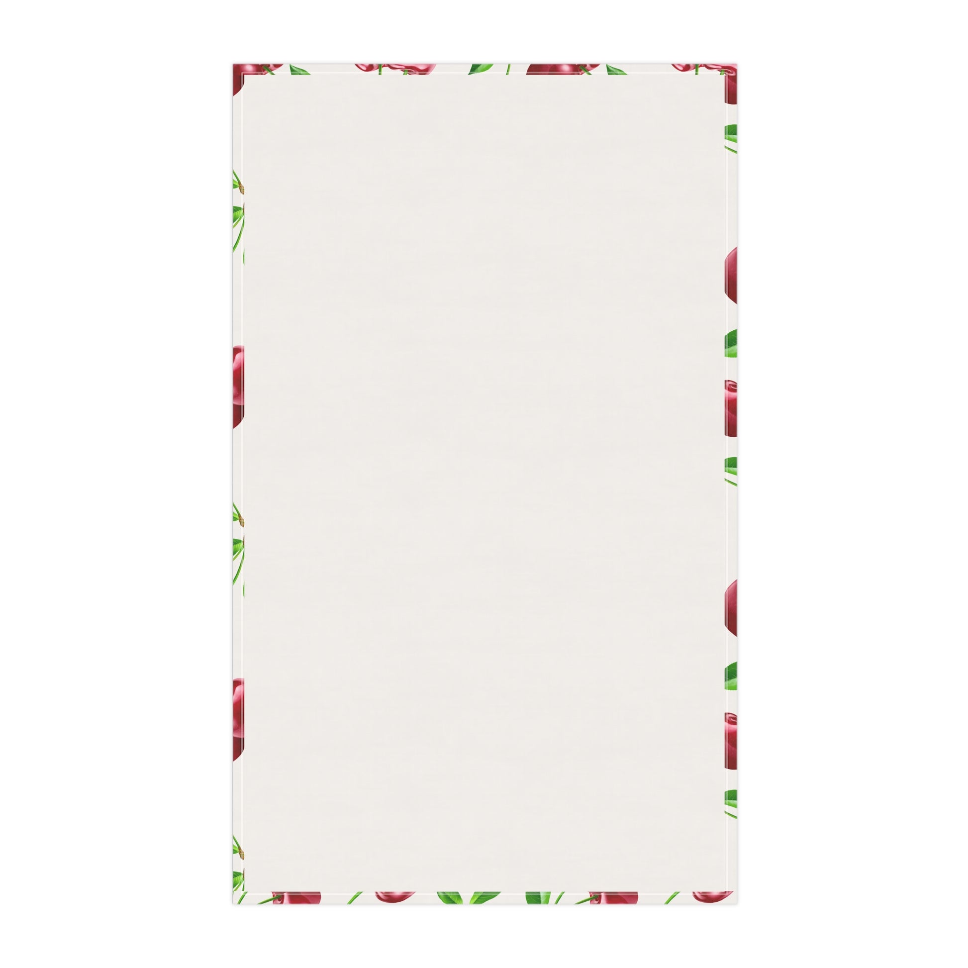 Backside of the White tea towel featuring a vibrant cherry print with green leaves.