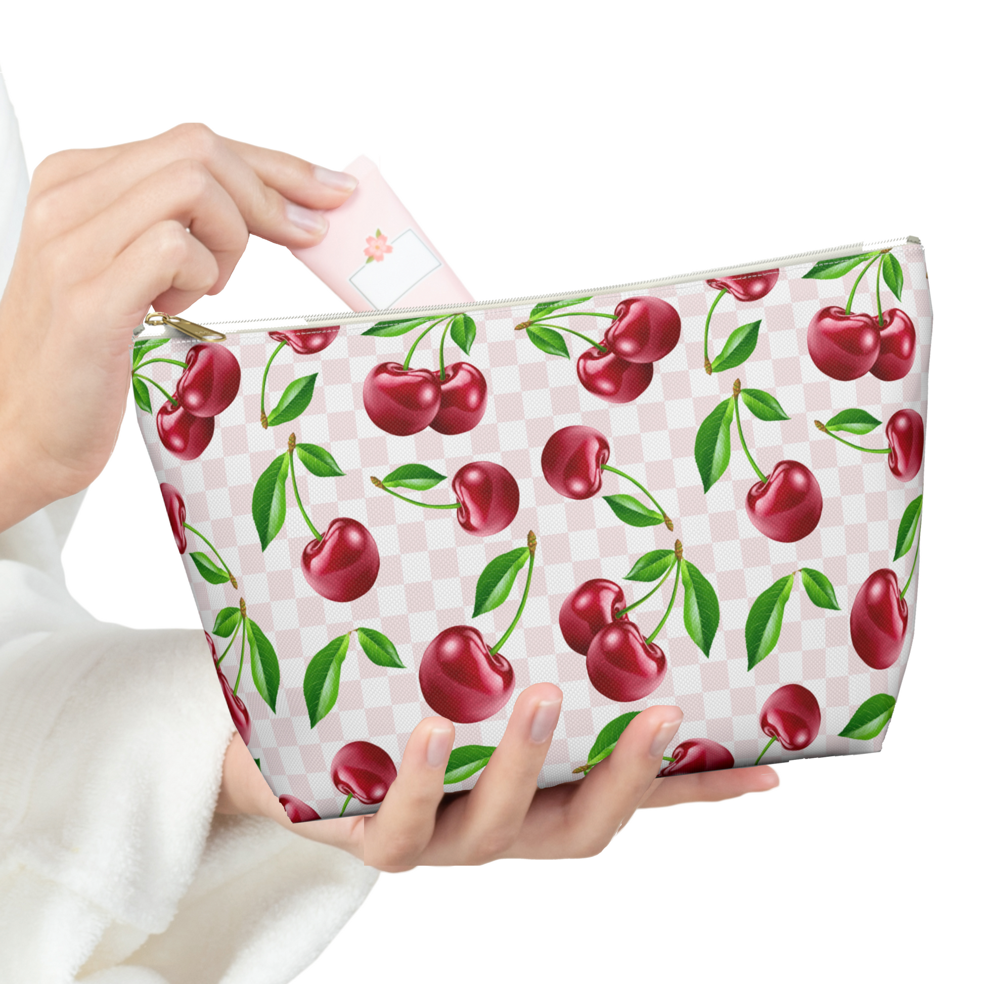 A woman holding a Cherry Makeup Bag