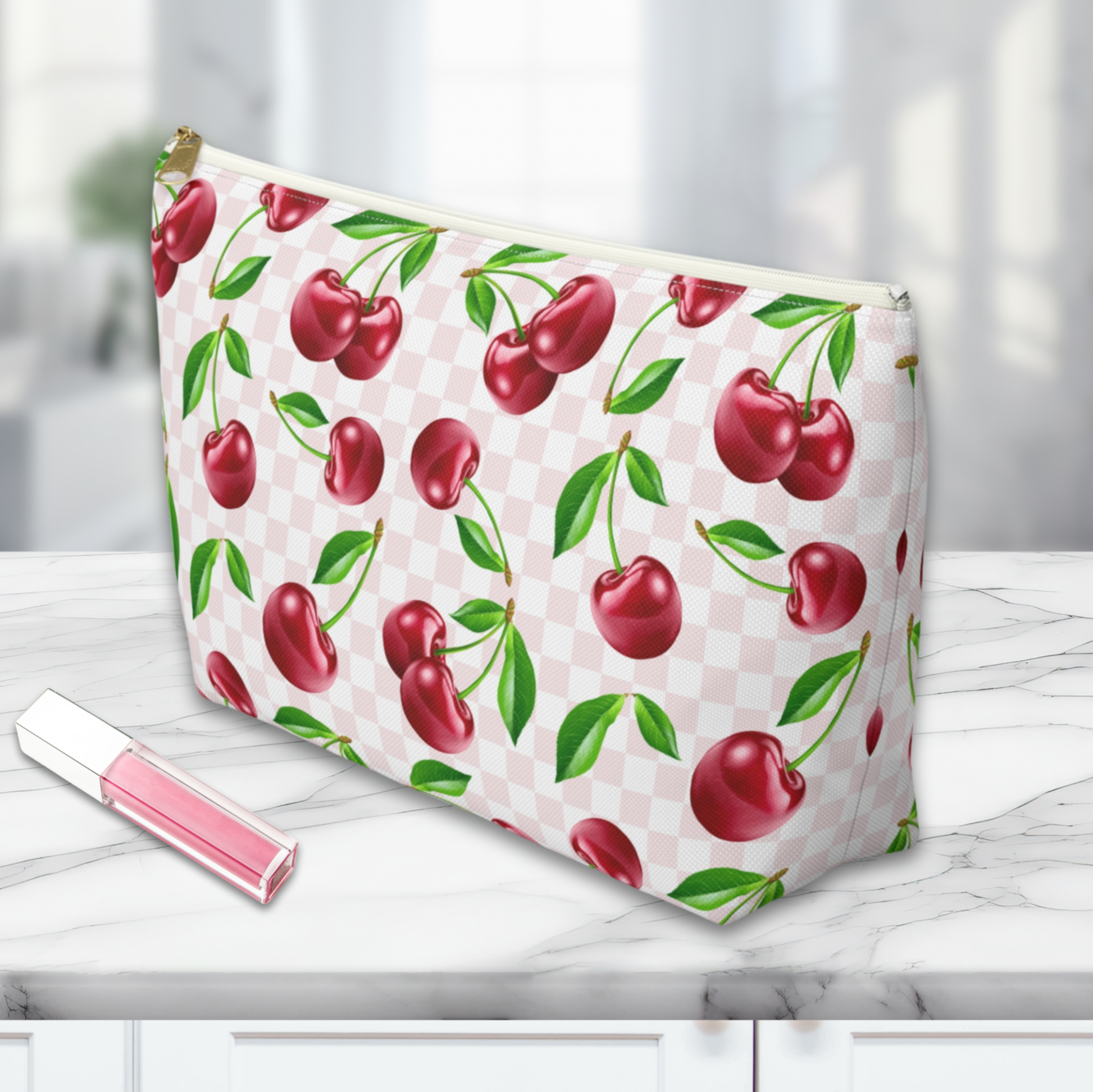 a Cherry Makeup Bag on a marble countertop