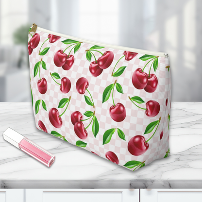 a Cherry Makeup Bag on a marble countertop