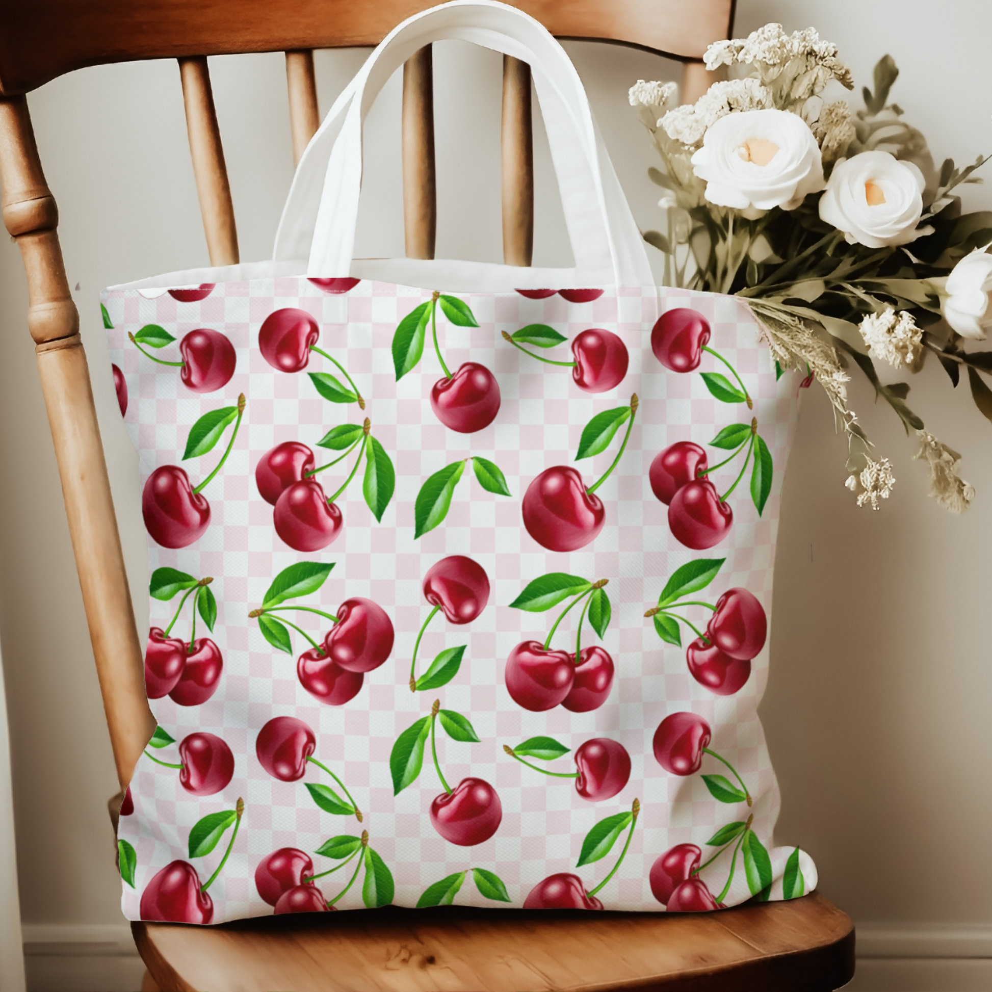 Cherry Print Tote Bag on a chair.