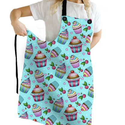 The Whimsical Cupcake Apron, brings a dash of sweetness to your kitchen with a fun and super-sweet design! Featuring a vibrant aqua background and adorable cupcake illustrations