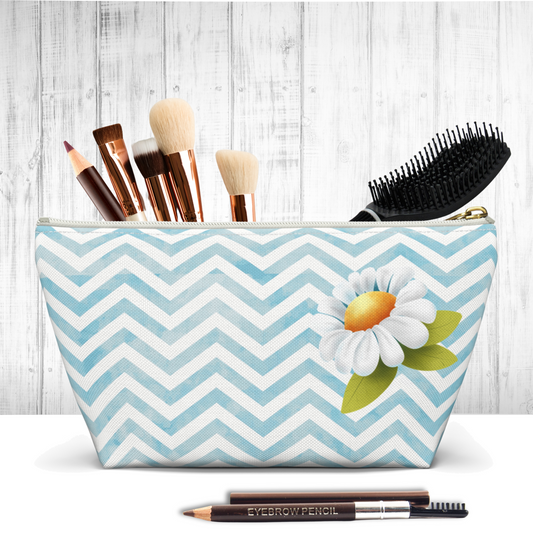 The Charming Blue Daisy Chevron Zipper Pouch is a delightful accessory that combines a watercolor blue chevron pattern with a delicate daisy motif.