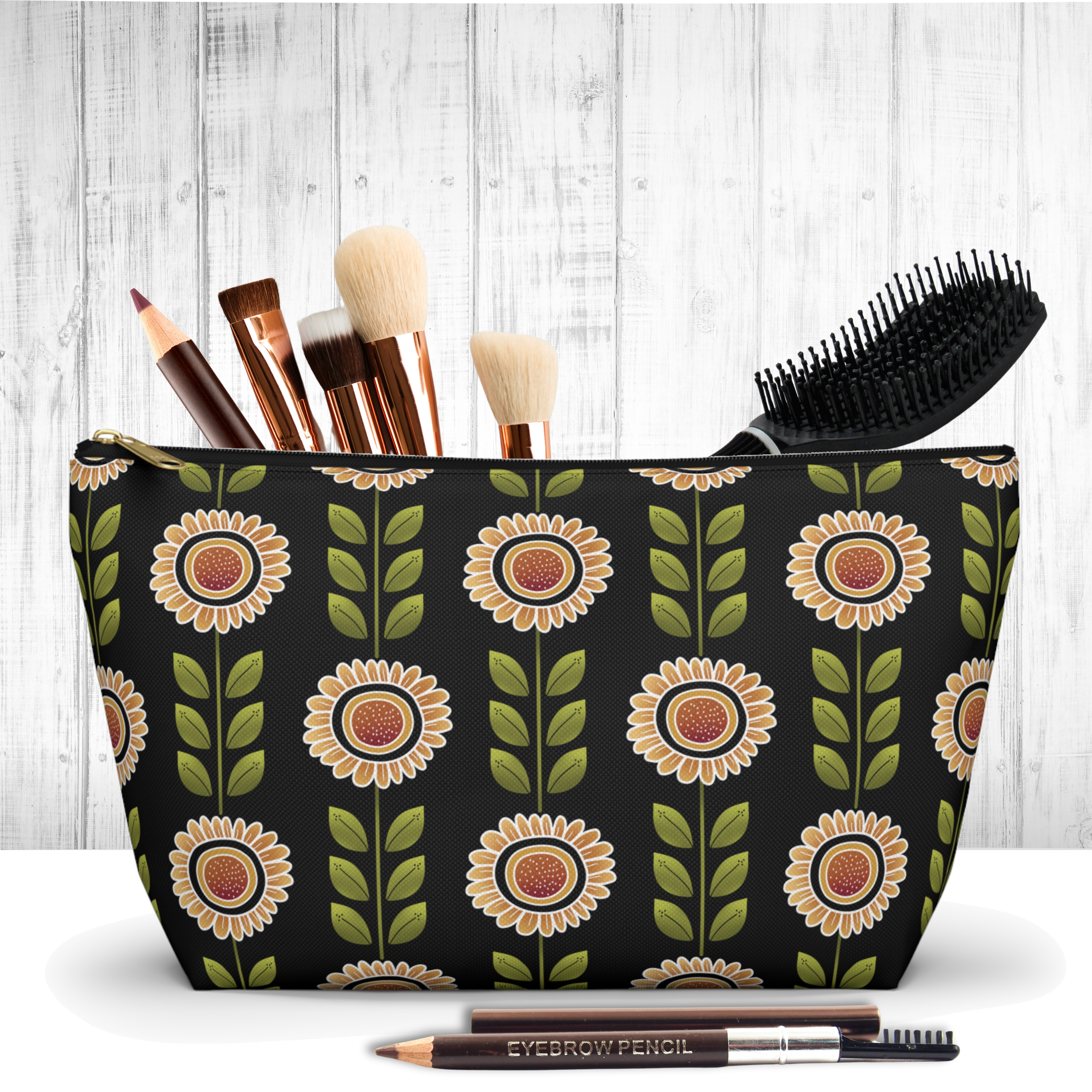 A retro sunflower design on a black background featured on a makeup bag.